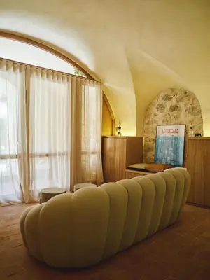 a living room with a couch and a table at Ajaccio Hypercentre, Superbe appartement dans une ancienne écurie du XVIIIe Siècle in Ajaccio