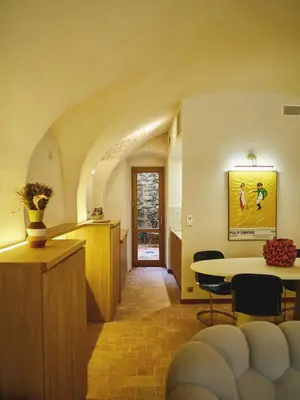 a hallway with a table and a dining room at Ajaccio Hypercentre, Superbe appartement dans une ancienne écurie du XVIIIe Siècle in Ajaccio