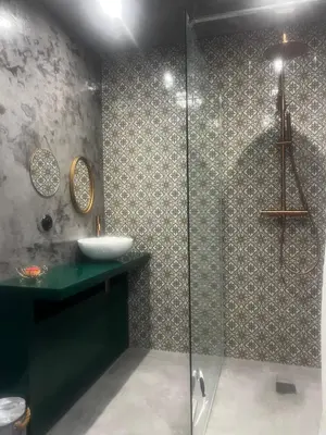 a bathroom with a sink and a glass shower at A Scontra in Moïta