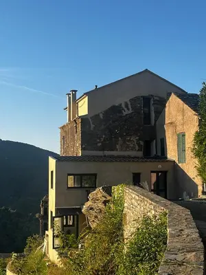 a house on the side of a mountain at A Scontra in Moïta