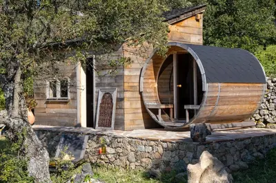 a small wooden house with a round roof at Magnifique Bergerie AMORE vue panoramique mer et montagne in Cargèse