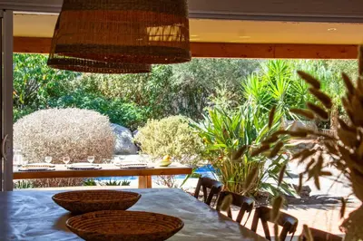 a dining room with a table and chairs at Casa Isabella Di Santa Lucia in Sainte-Lucie de Porto-Vecchio