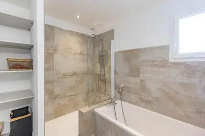 a bathroom with a shower and a bath tub at Villa Mara in Lecci
