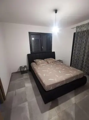 a bedroom with a bed in a room at Villa t4 in Lucciana