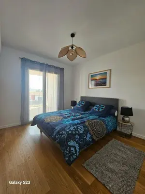 a bedroom with a bed and a ceiling fan at A Rundinella in Grosseto-Prugna