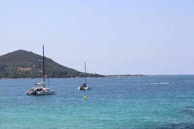 two boats floating in a large body of water at A Rundinella in Grosseto-Prugna