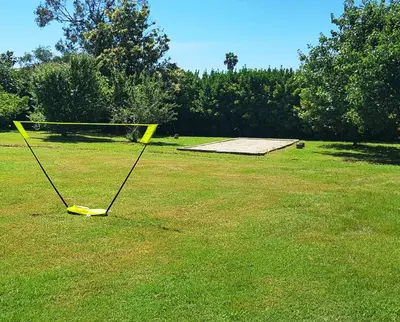 a net in the middle of a grass field at La Casalamadonna in Santa-Lucia-di-Moriani
