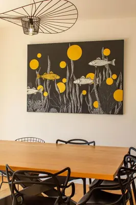 a painting of mushrooms on the wall in a dining room at Villa A Calia di Fiori Mare in Sainte-Lucie de Porto-Vecchio