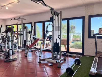 a gym with a bunch of tread machines in it at Royal Palm in Porto-Vecchio