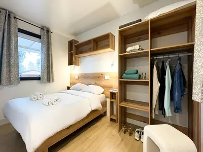 a bedroom with two beds and a closet at Campo Di Mare in Porto-Vecchio