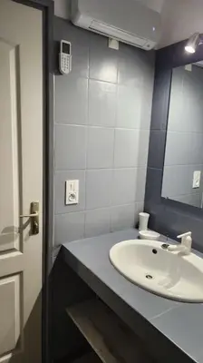 a bathroom with a sink and a mirror at Mini villa Favone in Conca