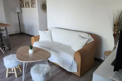 a living room with a couch and a table at Mini villa Favone in Conca
