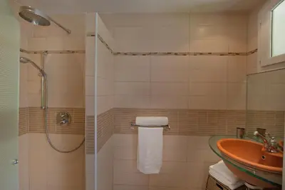 a bathroom with a sink and a shower at Studio Kalliste - Vision Luxe in Bonifacio