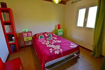 a bedroom with a bed and a wooden cabinet at Maison Capanelli in Casa delle Torre