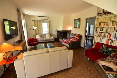 a living room with a couch and a table at Maison Capanelli in Casa delle Torre