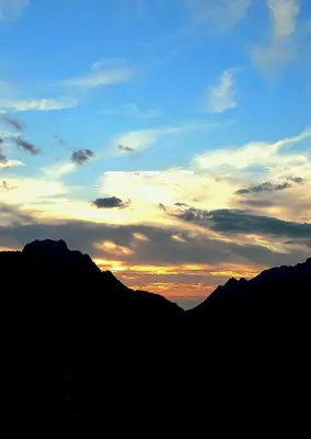 a sunset over the mountains with the sky at A casa di Francesca in Marignana