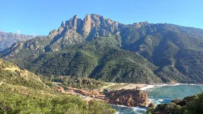 a mountain view of the ocean and a beach at A casa di Francesca in Marignana