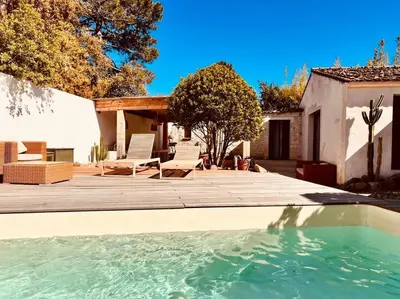 a swimming pool in front of a house at Casa Brahma pour 8 personnes -Porto Vecchio in San-Gavino-di-Carbini