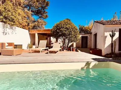 a swimming pool in front of a house at Casa Brahma pour 8 personnes -Porto Vecchio in San-Gavino-di-Carbini