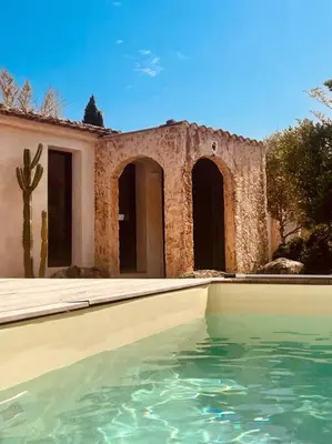 a house with a pool of water in front of it at Casa Brahma pour 8 personnes -Porto Vecchio in San-Gavino-di-Carbini
