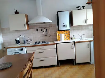 a bedroom with a bed and a window at Maison de village corse in Campitello