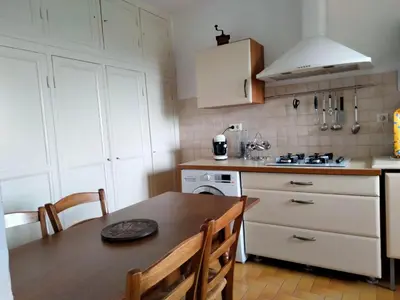 a living room with a couch and a table at Maison de village corse in Campitello