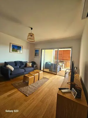 a living room with a couch and a table at A Cardellina in Porticcio