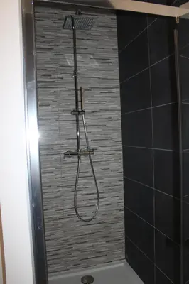 a shower with a shower head in a bathroom at A Cardellina in Porticcio
