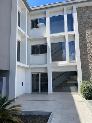 an exterior view of a white building at A Cardellina in Porticcio