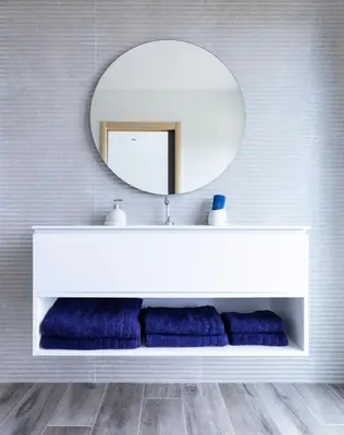 a bathroom with a white sink and a mirror at a STELLA DI FOCE in Kamiesch
