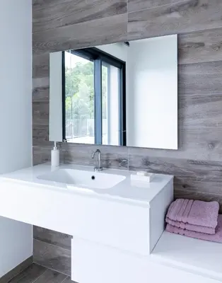 a bathroom with a white sink and a mirror at a STELLA DI FOCE in Kamiesch