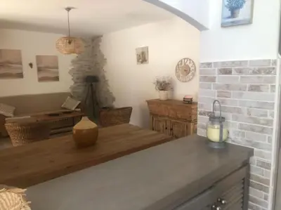 a kitchen with a counter with a candle on it at Villa à Cala-Rossa,Porto-Vecchio proche des plages in Le Ranch