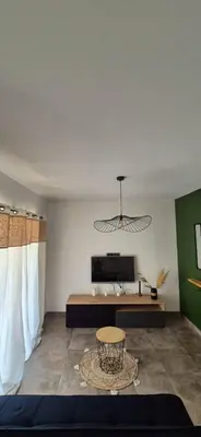a living room with a couch and a table at Charmant appartement in Borgo