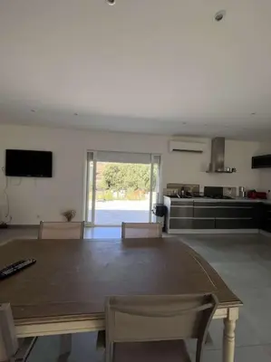 a bedroom with a bed and a sliding glass door at Casalea in Oletta