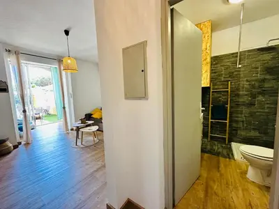 a bathroom with a shower and a toilet in a room at Casa Tania in Borgo