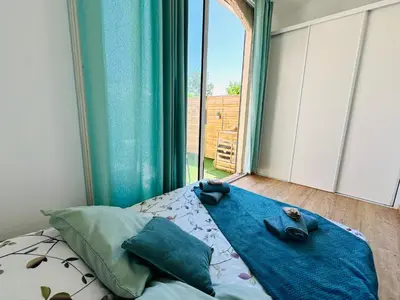 a bedroom with a bed and a large window at Casa Tania in Borgo