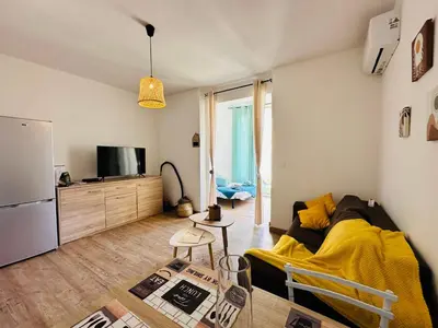 a living room with a couch and a tv at Casa Tania in Borgo