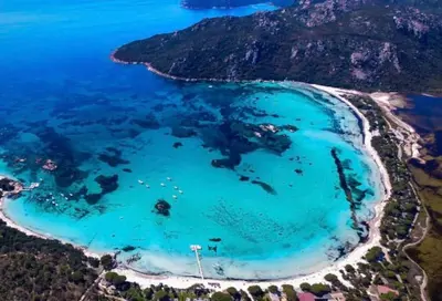 an aerial view of a beach with turquoise water at Logement Mésange600m à pied de SantaGiulia Jacuzzi in Porto-Vecchio