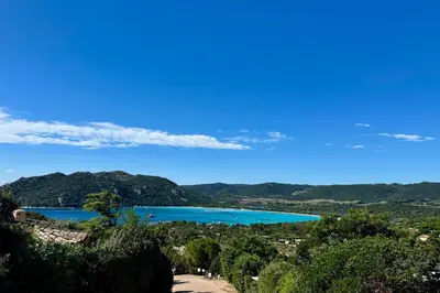 a view of a lake from a hill at Adorable duplex vue mer 5 min à pied de Santa Giulia in Porto-Vecchio