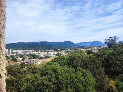 a view of a city with mountains in the background at Vacances AJACCIO in Ajaccio