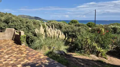 a view of the ocean from the top of a house at Villa Nitiola Plage de Palombaggia in Bocca del Oro