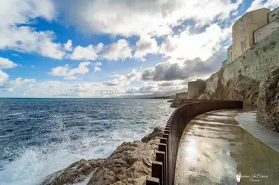 a view of the ocean from the side of a cliff at CASA NINA FURIANI CORSE Appartement en résidence in Paterno