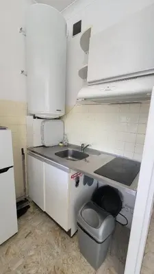 a small kitchen with a sink and a toilet at La plage à vos pieds, magnifique vue sur Ajaccio, pour 2 personnes in Ajaccio