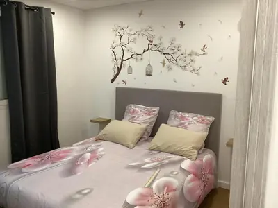 a bedroom with a bed with pink bunny pillows at Appartement Bavella in Santa-Lucia-di-Moriani