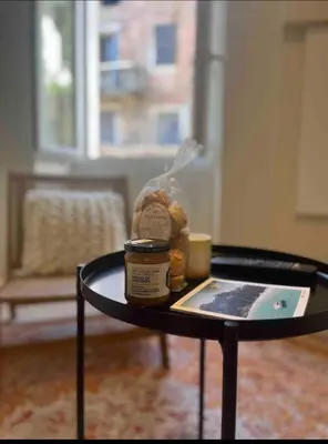a living room with a couch and a table at Charmant appartement Olmeto in Olmeto