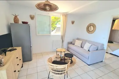 a living room with a couch and a table at Apartment with balcony and 360 sea view in Villanova