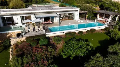 an aerial view of a house with a swimming pool at Giulia, villa exceptionnelle, vue mer et Ajaccio in Porticcio