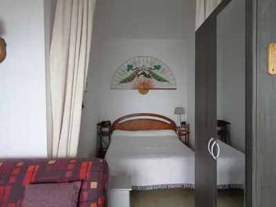 a small bedroom with a bed and a window at t1 bis vue imprenable in Ajaccio