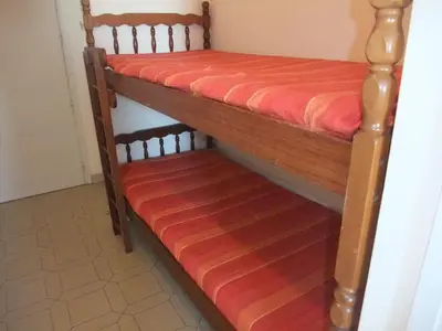 a couple of bunk beds in a room at t1 bis vue imprenable in Ajaccio