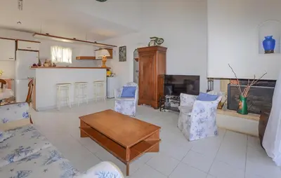 a living room with a table and chairs at Beautiful Home In Cervione With Wifi in Cervione